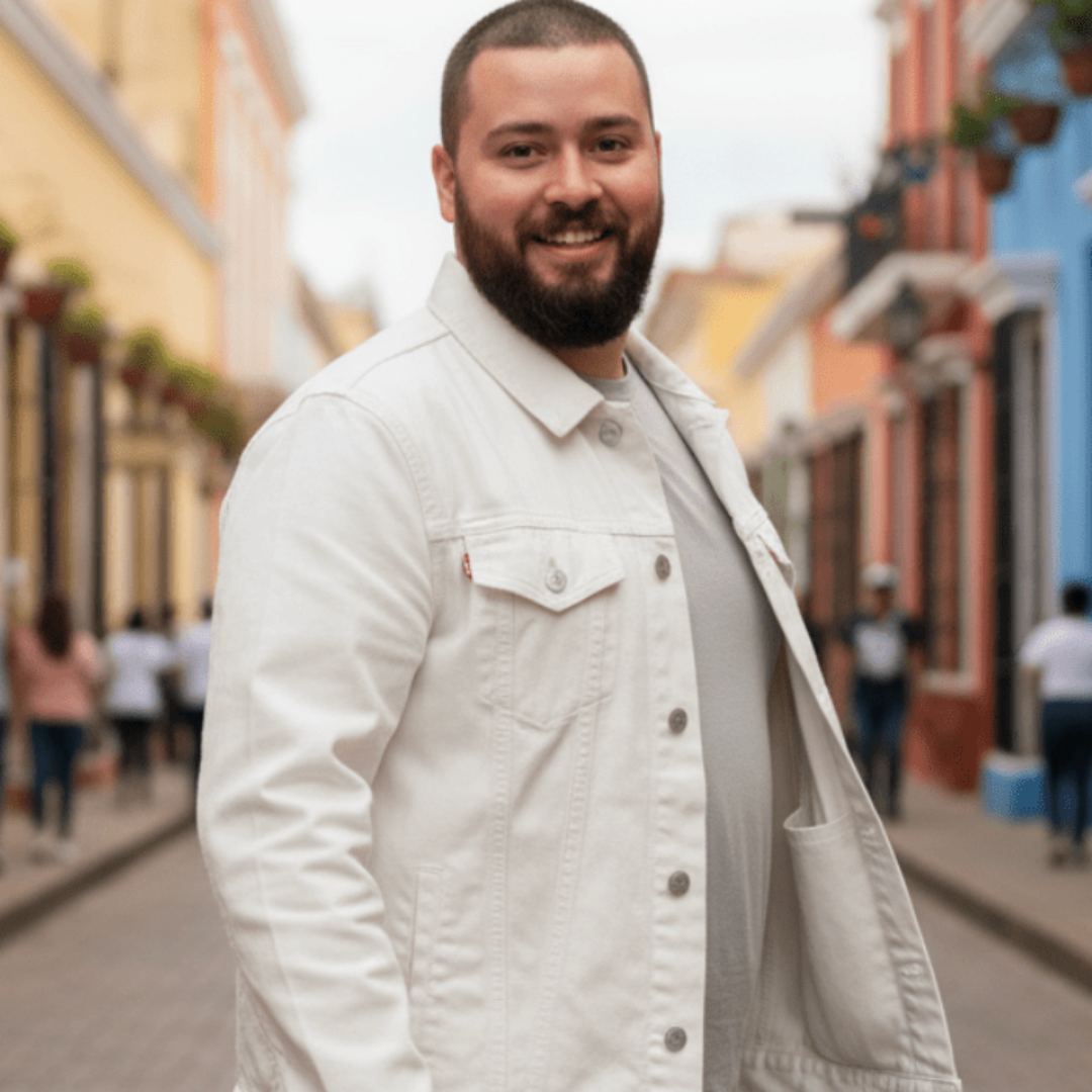 person wearing a white denim jacket on a city street with one inside hidden pocket visible, showing jacket fit and pocket placement