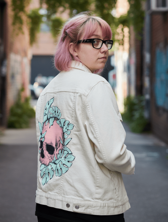 BOTANICAL SKULL by JESS ADAMS, digitally printed on DENIM products: throw pillows, aprons, table place mats, and hand-crafted Unisex Denim Jackets in 3 color choices