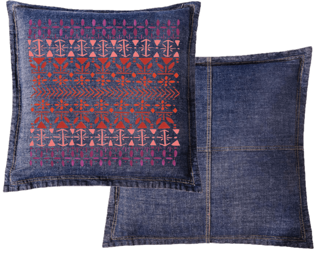 Denim pillow a vertically aligned Scandinavian folk pattern "Norwegian Pattern" by CatCoq made of repeating geometric rows including tulip shapes, arrows, diamonds, snowflakes & stylized trees. the hand-painted elements fade from deep violet at the top to coral & rust red toward the center, then shift to pink & purple again. printed by DenimINK