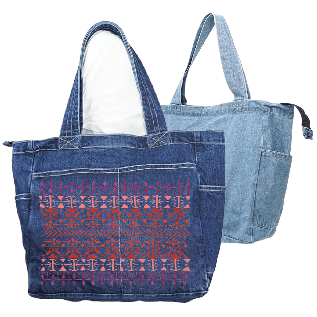 Denim tote bag with a vertically aligned Scandinavian folk pattern "Norwegian Pattern" by CatCoq made of repeating geometric rows including tulip shapes, arrows, diamonds, snowflakes & stylized trees. the hand-painted elements fade from deep violet at the top to coral & rust red toward the center, then shift to pink & purple again. printed by DenimINK