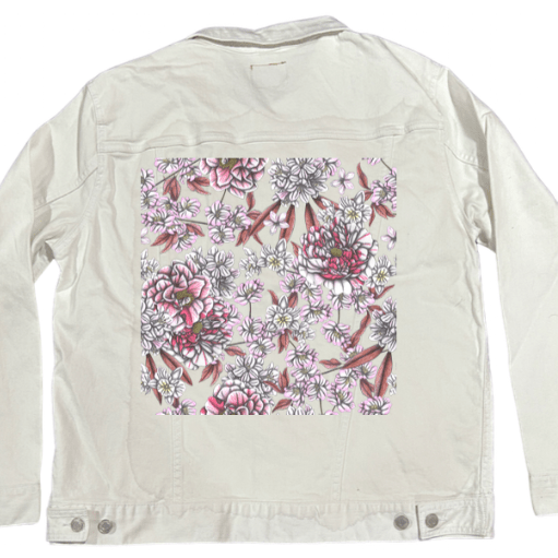 back view of a white denim jacket featuring a crisp panel of blooming peonies & clustered blossoms shaded in pencil textures, pink tints & ivory tones, with fine dusty rose leaves layered beneath. the artwork “Pink Afternoon” by Cecilia Battaini is digitally printed on the jacket’s back panel by DenimINK.