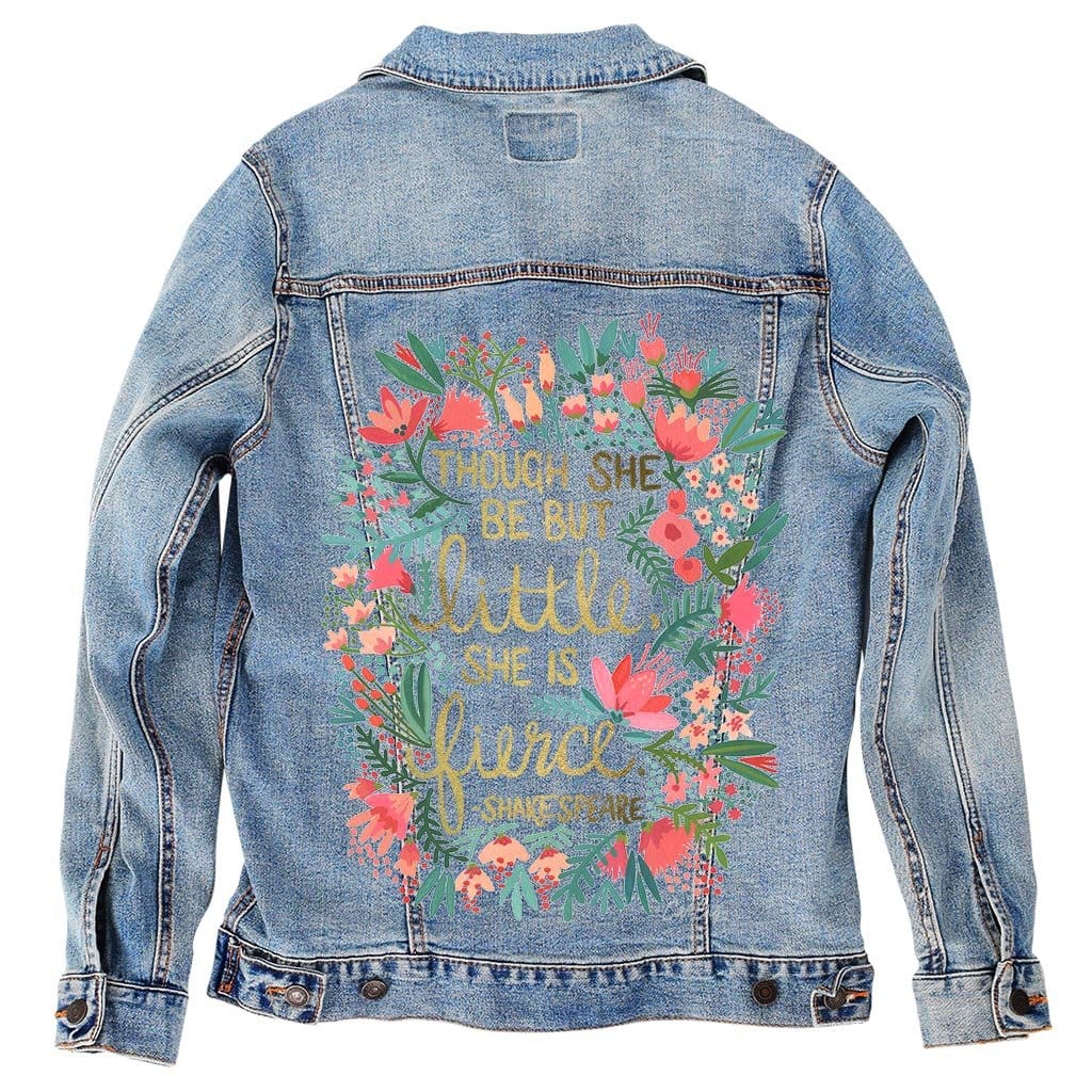 back view of a stonewashed denim jacket printed with the “Little & Fierce” artwork by CatCoq. the quote is framed by a full floral wreath in pastel hues of blush, coral & sage green. the textured watercolor details blend beautifully with the faded wash of the denim. digitally printed by DenimINK.