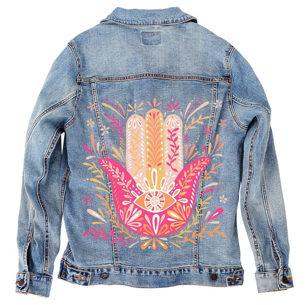 back view of a stonewashed denim jacket printed with the “Hamsa Hand” artwork by CatCoq. the centered design features a radiant hamsa hand in blended pink, gold & coral tones, filled with floral patterns, leafy stems & a symbolic eye at the center. the washed denim softens the contrast slightly while preserving the detail in the intricate lines. the design is digitally printed by DenimINK.