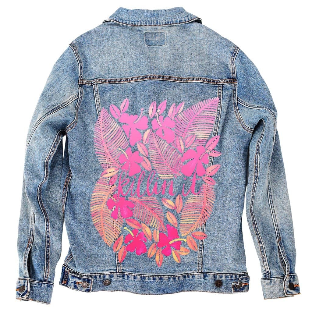back view of a stonewashed denim jacket printed with the artwork “Killin' It” by CatCoq. the design features large pink tropical ferns & floral clusters surrounding a handwritten script reading “killin it.” colors include coral, magenta & soft blush, layered with gentle watercolor transparency. the stonewashed denim gives the piece a relaxed texture that softens the vibrant tones. digitally printed by DenimINK.