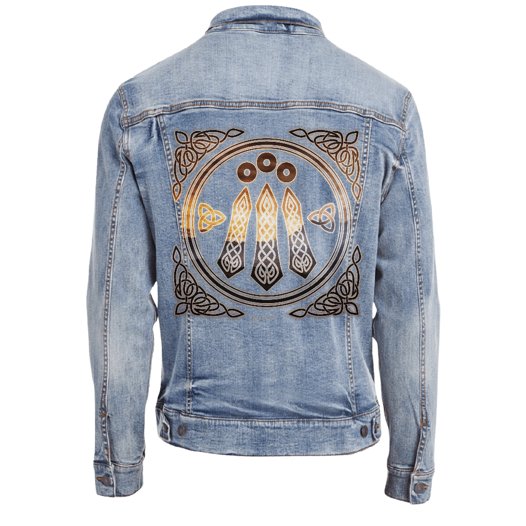 back view of a stonewash blue denim jacket featuring the artwork “Celtic Awen” by Brigid Ashwood, printed large and centered on the back panel. the design shows a circular Celtic emblem with three vertical Awen rays and surrounding knotwork, rendered in warm bronze and gold tones. the luminous lines contrast clearly against the faded stonewash denim. digitally printed by DenimINK.