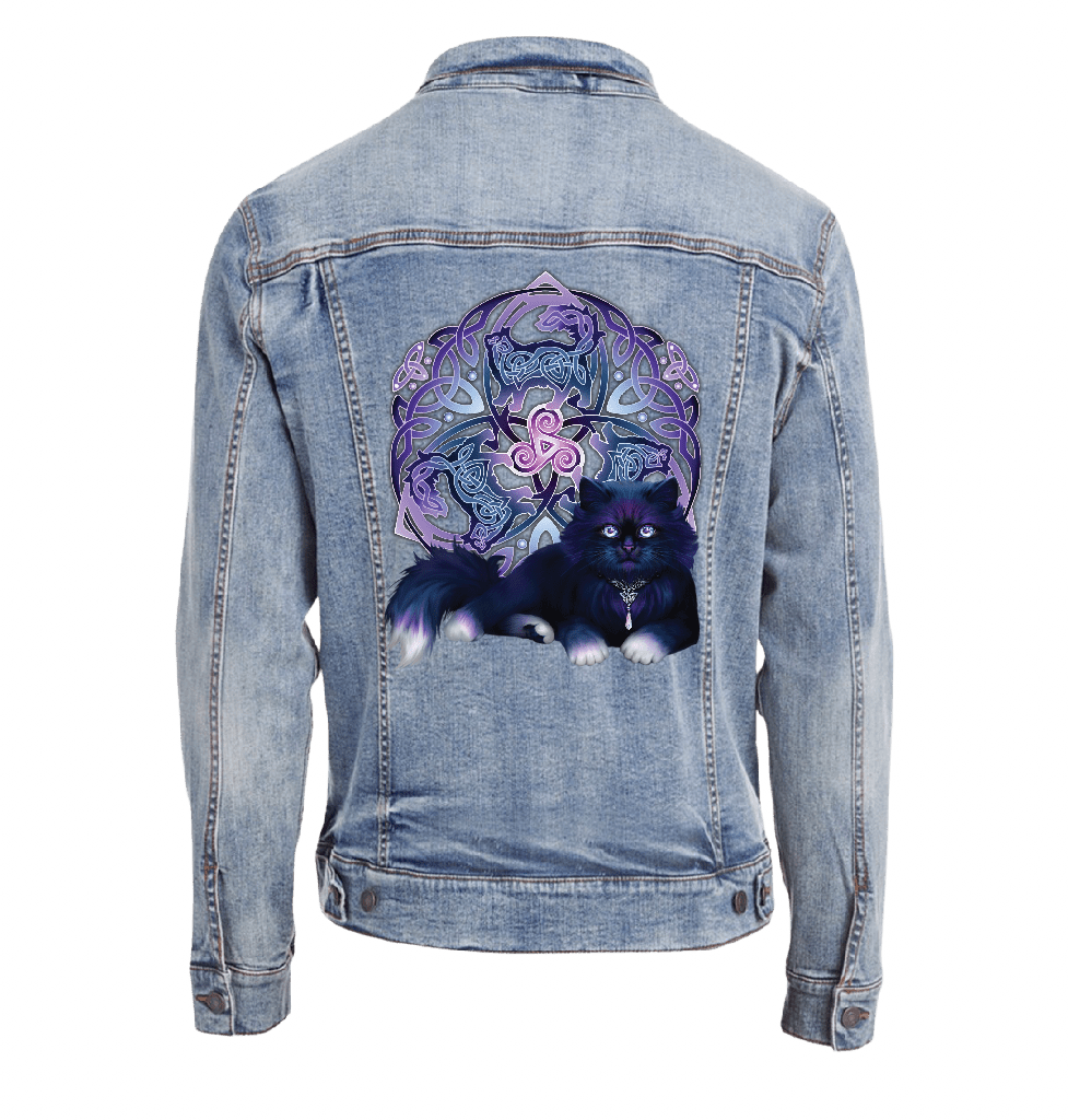 back view of a stonewash blue denim jacket featuring the artwork “Celtic Black Fluffy Cat” by Brigid Ashwood, printed centered on the back panel. the design shows a fluffy black cat with violet-blue highlights resting in front of an intricate Celtic knotwork emblem and glowing triskelion in purple and blue tones. the luminous details contrast clearly against the faded stonewash denim. digitally printed by DenimINK.