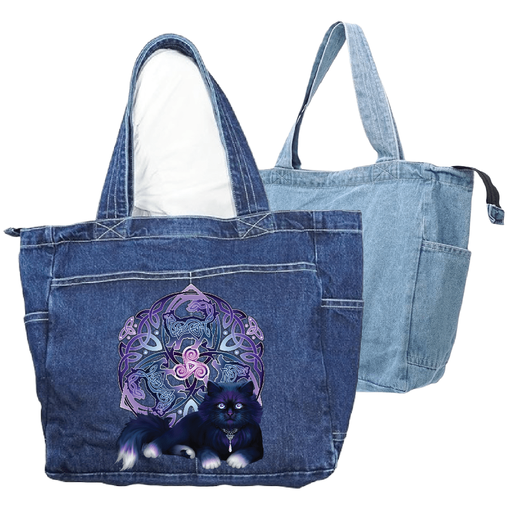 front view of a classic blue denim tote bag and back view of a stonewashed denim tote bag featuring the artwork “Celtic Black Fluffy Cat” by Brigid Ashwood, printed large and centered on the front panel. the design shows a fluffy black cat with violet-blue highlights resting in front of a glowing Celtic knotwork emblem and triskelion in purple tones. the artwork contrasts clearly against the textured blue denim. the zippered tote bag features reinforced handles and exterior pockets. digitally printed by D
