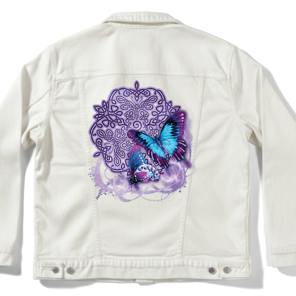 back view of a white denim jacket featuring the artwork “Celtic Butterfly” by Brigid Ashwood, printed centered on the back panel. the design shows two luminous blue and purple butterflies in flight over an intricate Celtic knotwork motif with soft glowing accents. the vibrant colors stand out clearly against the clean white denim. digitally printed by DenimINK.
