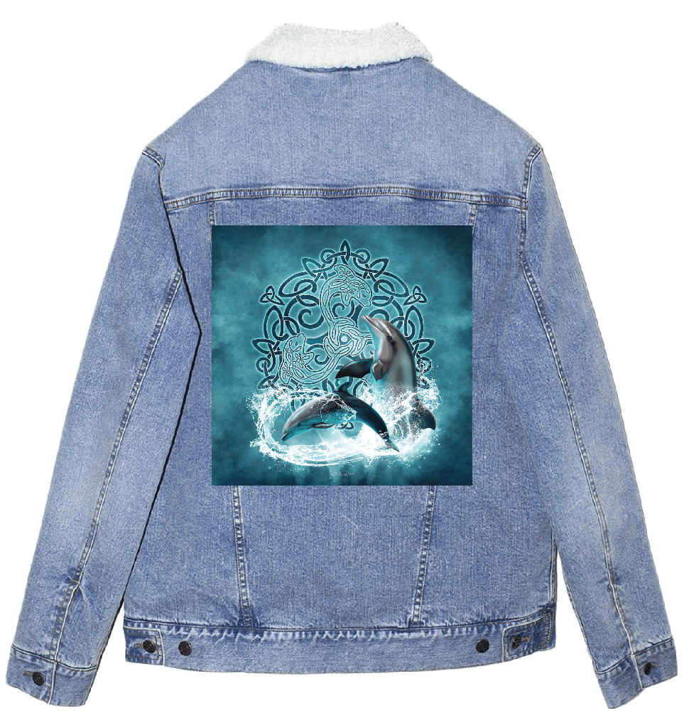 back view of a stonewash blue denim jacket featuring the artwork “celtic dolphin” by brigid ashwood, printed centered on the back panel. the design shows two realistic dolphins emerging through splashing water in front of an intricate teal and turquoise celtic knotwork circle on a softly glowing aqua background. the jacket includes an off-white sherpa-style liner visible at the collar and traditional denim seam construction. digitally printed by DenimINK.