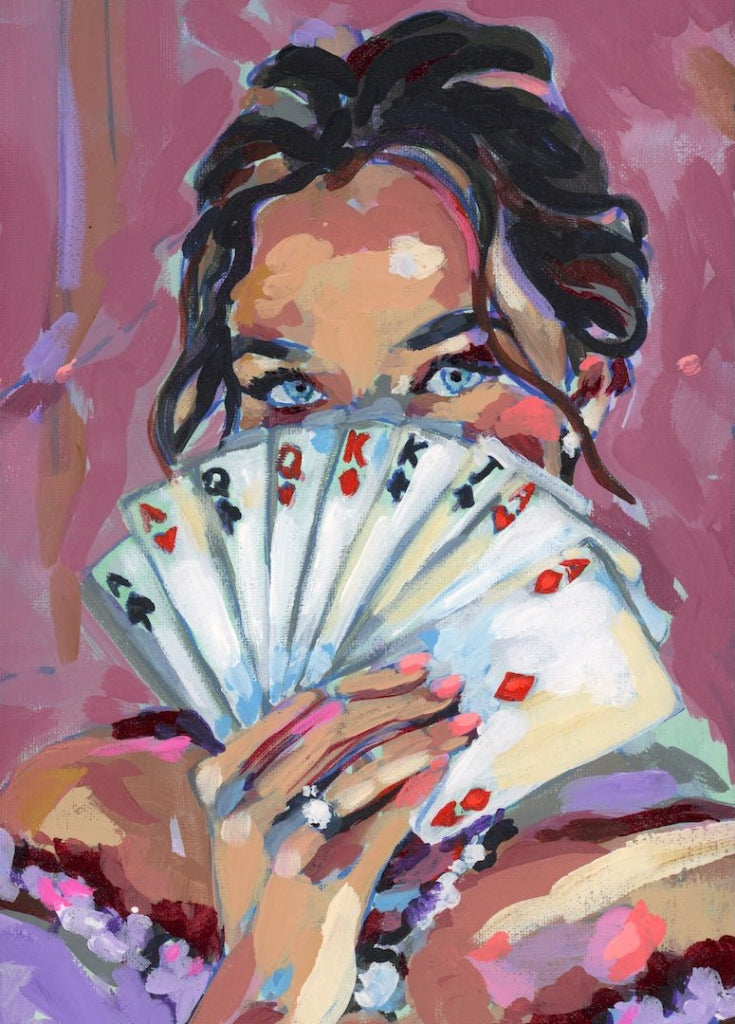 illustration of A woman holding a fan of playing cards in front of her face, revealing only her blue eyes. the cards show red and black suits including hearts, diamonds, clubs, and spades, painted in loose, layered strokes. Her dark hair is pulled back with soft curls framing her face, and a ring is visible on her finger. the background is a textured blend of mauve, pink, and lavender paint. This artwork is titled “Fanned Cards Girl” and created by Paige Flotterud