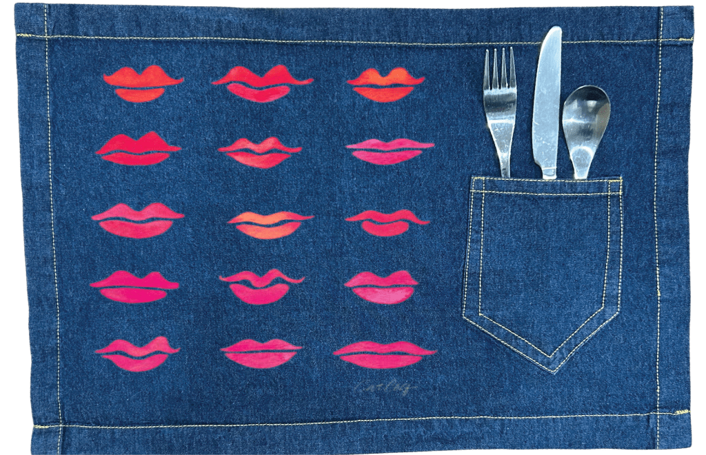 Denim placemat with pink lip pattern and cutlery pocket . Kiss-Collection-by-CatCoq-table-placemat-with-utensils-WIDE-mockup