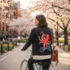 Octopus Riding a Bicycle by Amelie Legault, printed on a hand-made Unisex Denim Jacket