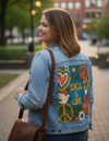PEACE AND LOVE GREEN by KITSCH AND CURATE, digitally printed on a hand-made Unisex Denim Jacket