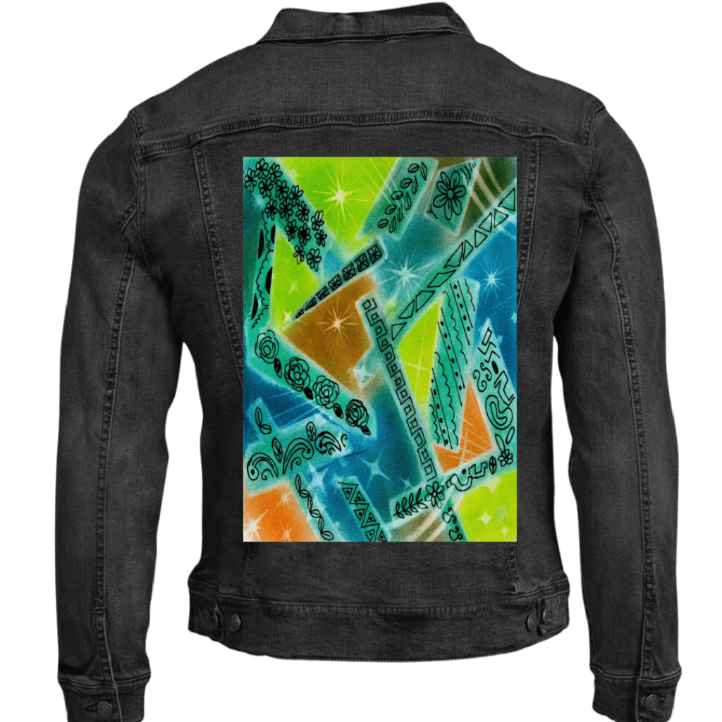 black denim jacket mockup with abstract artwork featuring overlapping shapes in green, blue, orange, and yellow with spray-paint texture, scattered starbursts, and hand-drawn floral, leaf, and geometric line motifs arranged throughout the composition. this artwork is titled “Abstract Magic” and created by Canvas &amp; Quotations (Monika Chugh and Alka Chopra) printed by DenimINK
