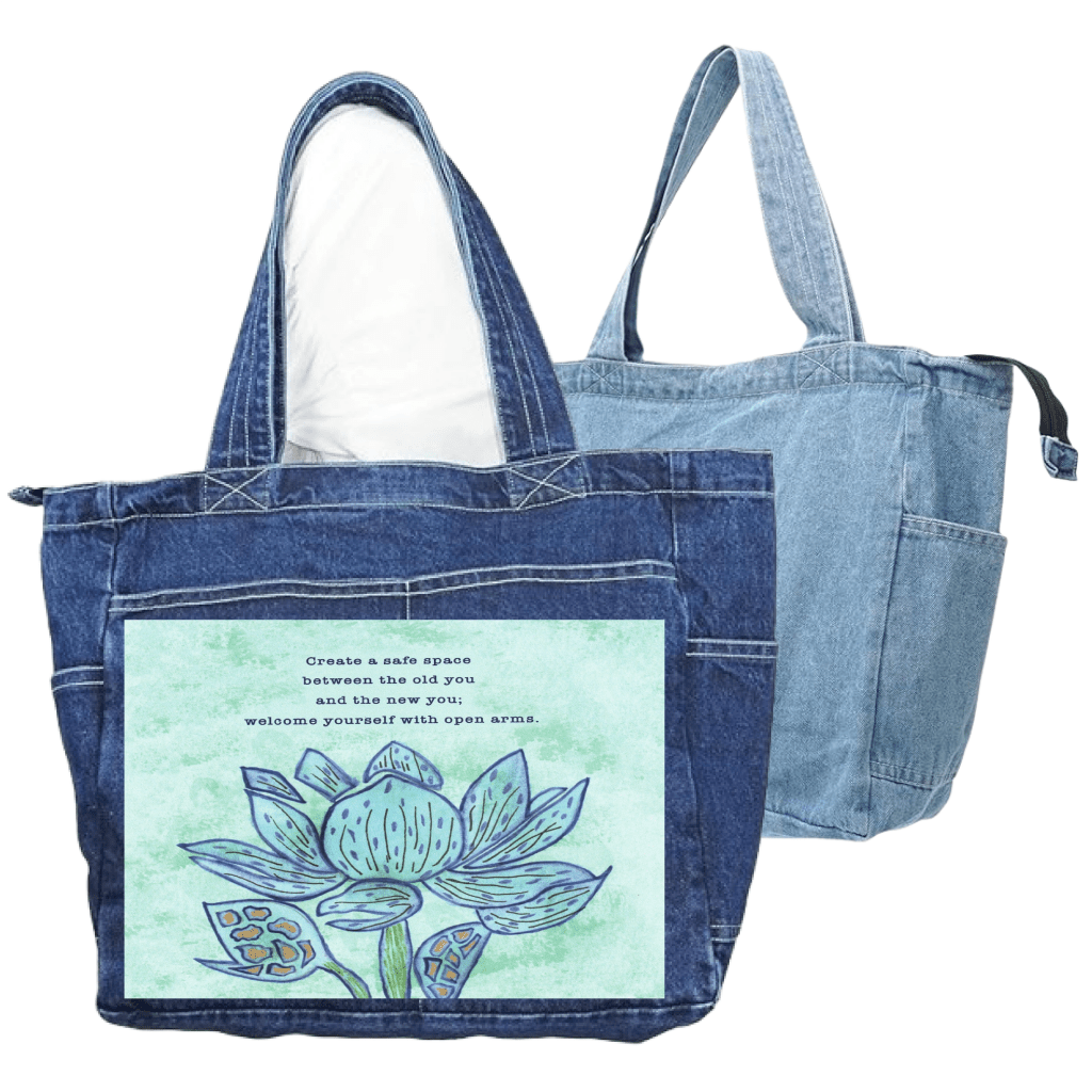 a blue denim tote bag and a stonewashed denim tote bag featuring a blue lotus flower on a textured light-green background, paired with the quote “Create a safe space between the old you and the new you; welcome yourself with open arms.” the artwork is titled “Always Welcome Yourself” and created by Canvas &amp; Quotations (Monika Chugh and Alka Chopra) and printed by DenimINK. bags are zippered with end pockets and side pocket