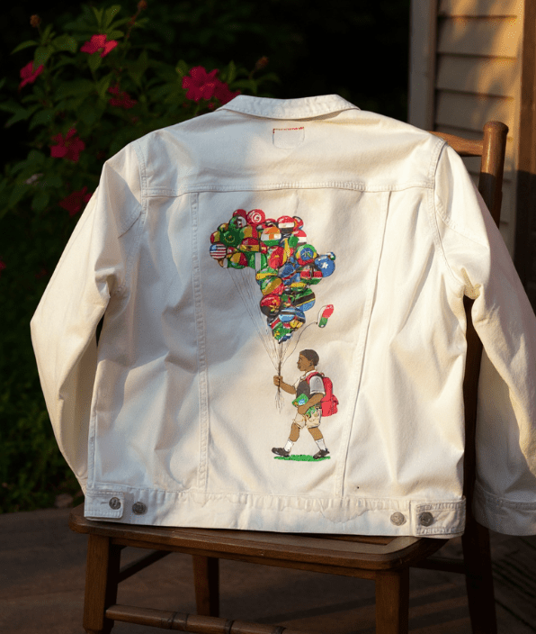 BALLOON BOY, by THE NYGERIANS,printed by DenimINK on hand-crafted Denim Jackets and other denim products and other denim products: tote bags, throw pillows, table place mats, aprons