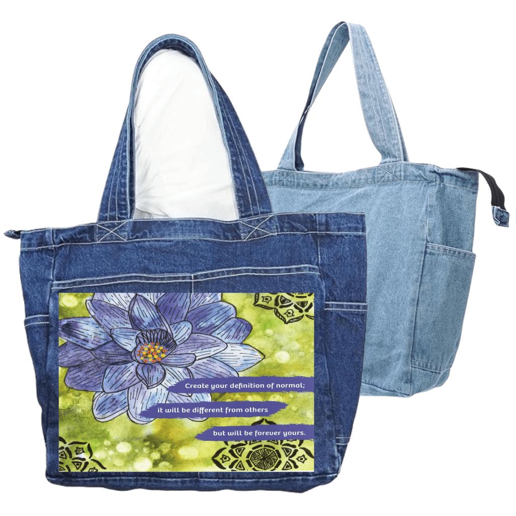 a blue denim tote bag and a stonewashed denim tote bag that are zippered, with pockets on the ends and an outside large pocket.  featuring a blue and purple lotus flower on a textured green background, paired with the quote “Create your definition of normal; it will be different from others but will be forever yours.” decorative black mandala-style motifs appear in the corners. this artwork is titled “Be Your Normal Self” and created by Canvas &amp; Quotations (Monika Chugh and Alka Chopra), printed by DenimINK