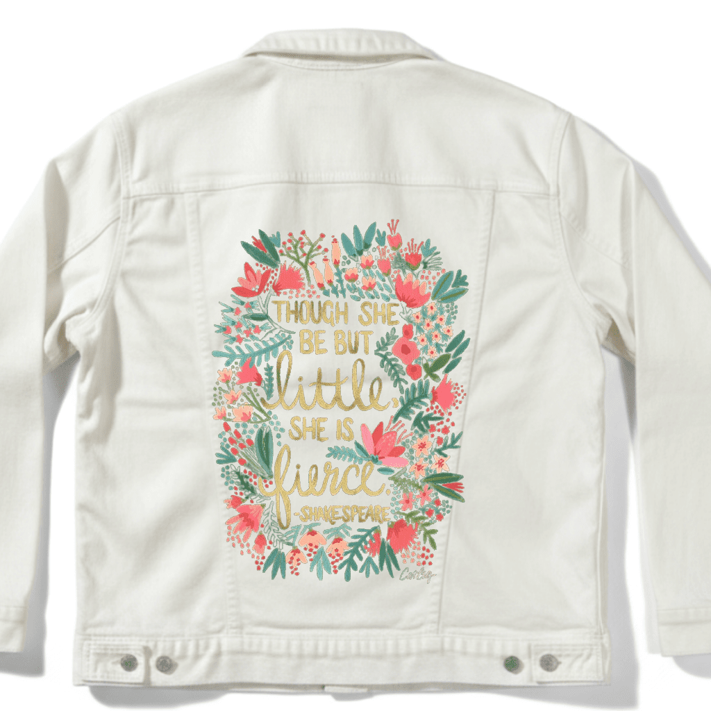 White jacket with floral design and text on a white background with Shakespears quote "Though She Be But Little, She is Fierce" printed by DenimINK.   Little and Fierce by CatCoq  mockup.
