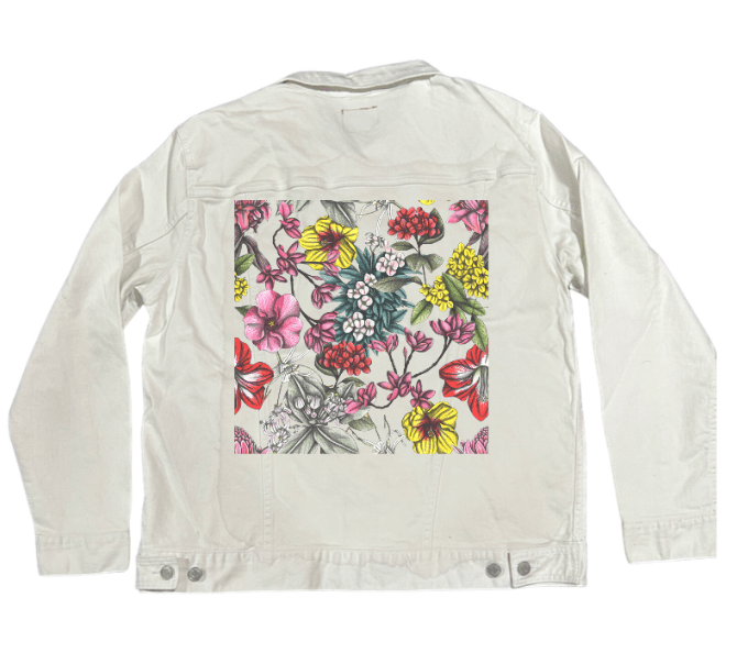 back view of a white denim jacket showcasing a richly detailed floral pattern of hand-drawn tropical blooms in soft red, fuchsia, sunshine yellow, lavender, mint, &amp; pale green. delicate pencil shading softens the vibrant palette. the artwork “Night in India” by Cecilia Battaini is digitally printed on the jacket’s back panel by DenimINK.