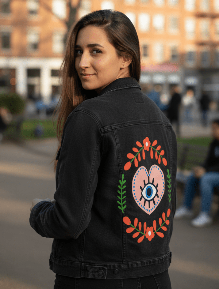 THE HEART SEES by HEND SHEHATA,printed by DenimINK on hand-crafted Denim Jackets and other denim products and other denim products: tote bags, throw pillows, table place mats, aprons