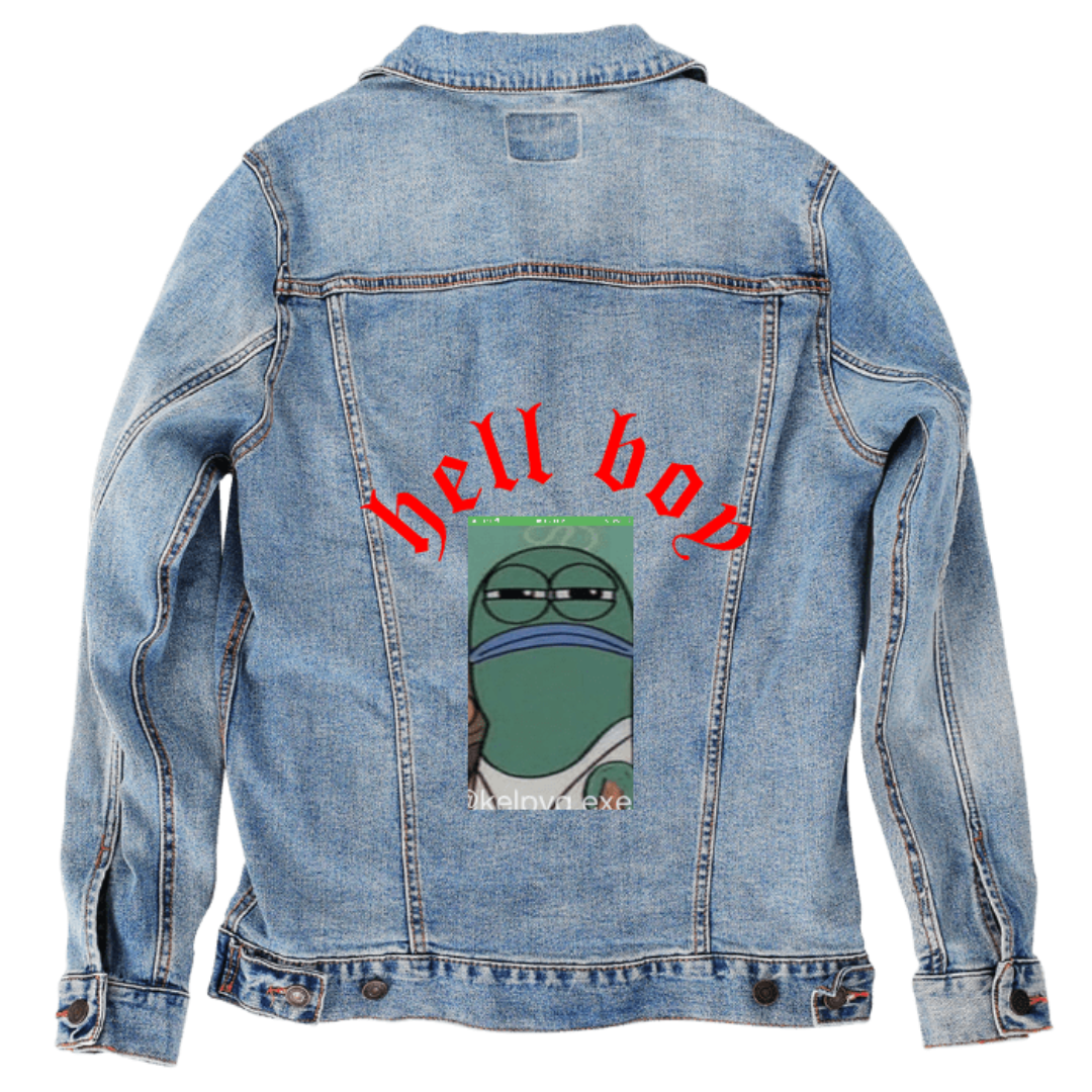 Customer designed custom denim jacket (L stonewash) featuring bold arched red lettering reading “hell boy” across the upper back, paired with a humorous cartoon frog portrait printed below, showing the frog with a tired, unimpressed expression and muted green and blue tones. The playful mix of edgy text and quirky illustrated character stands out against the soft, faded blue denim, creating a bold street-style aesthetic, printed on denim jacket by DenimINK.