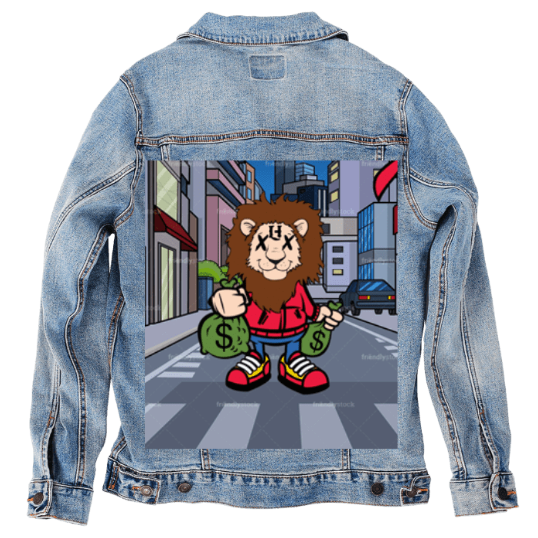 Customer designed custom denim jacket (S stonewash) featuring a vibrant cartoon-style illustration printed on the back, showing a cheerful lion character standing in a colorful city street while holding two green money bags. The lion wears a red hoodie, blue pants, and bright sneakers, with tall buildings and cars in the background. The playful, bold artwork adds a fun, animated feel against the soft, faded blue denim, printed on denim jacket by DenimINK.