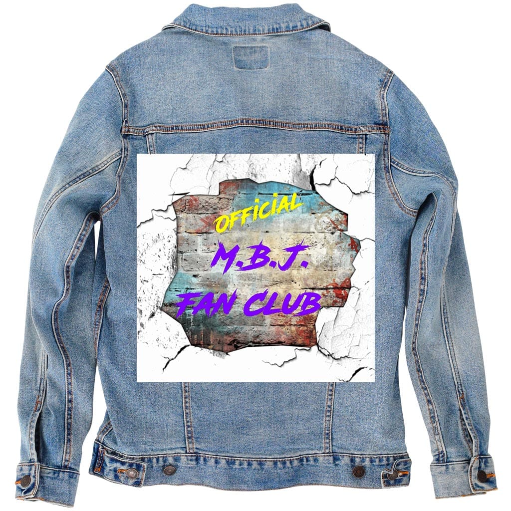 Back view of a stonewashed denim jacket displayed as a studio mockup, featuring a square cracked-wall style artwork centered on the back panel. Torn white edges expose layered rust, teal, and concrete textures beneath vibrant yellow and purple “OFFICIAL M.B.J. FAN CLUB” lettering. The lighter denim lets the artwork breathe, blending raw texture with nostalgia, like sound echoing off painted walls.