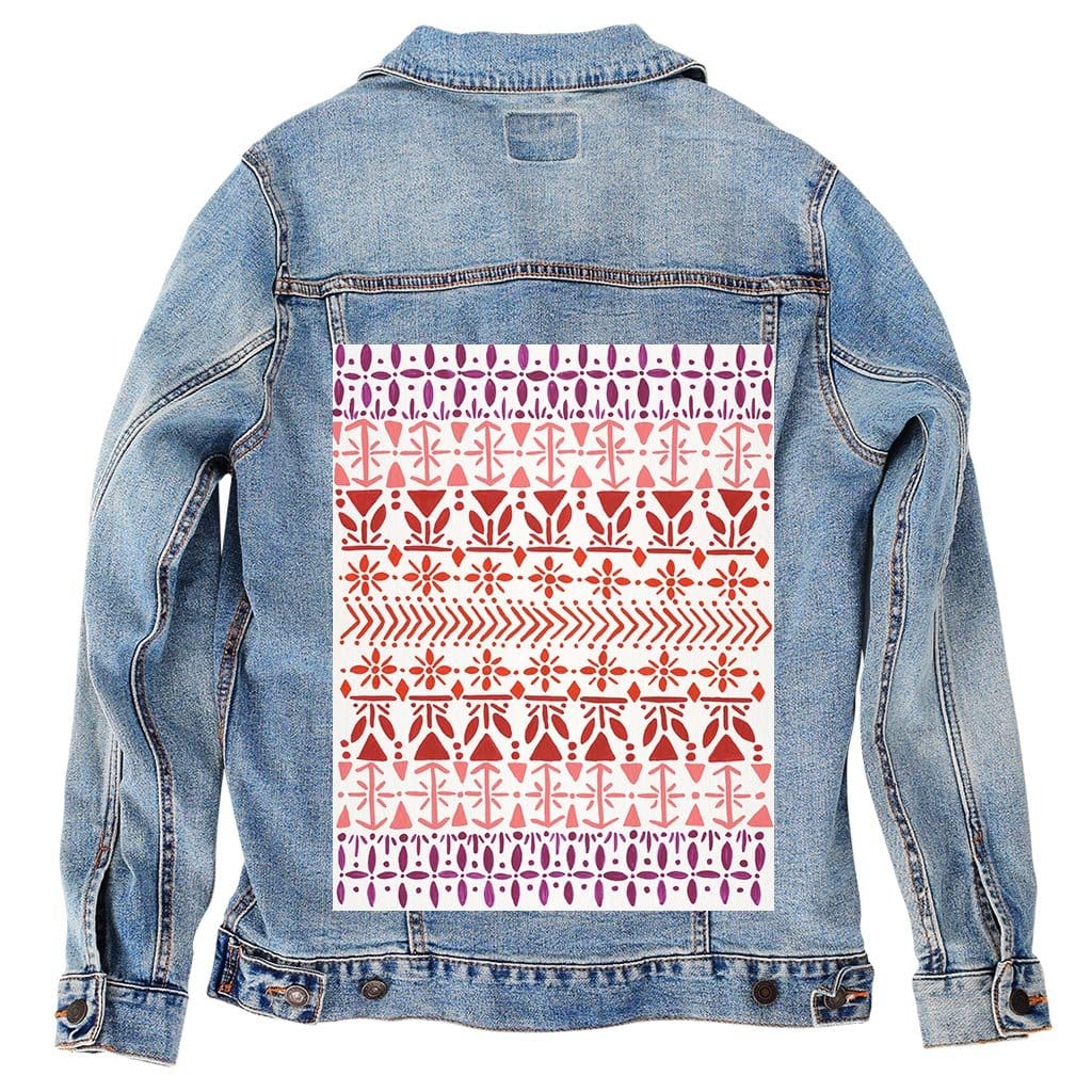 back view of a stonewashed denim jacket printed with the “Norwegian Pattern” by CatCoq. the design includes repeated rows of stylized tulips, leaves, arrows, &amp; snowflakes that fade from violet at the top to deep red &amp; blush pink below. the folk-inspired layout appears centered &amp; vertically stacked. the washed denim softens the contrast while preserving the detailed watercolor texture. printed by DenimINK.